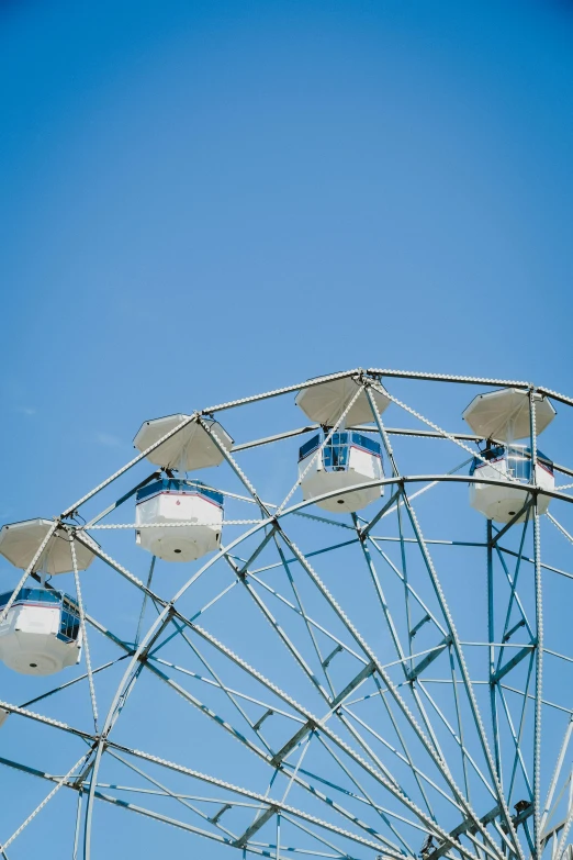 a ferris wheel against a clear blue sky