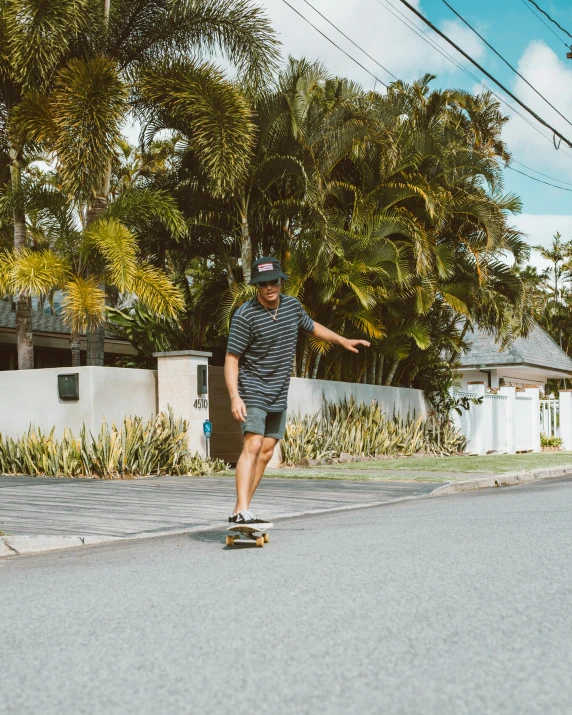 a man riding a skateboard down the middle of a street