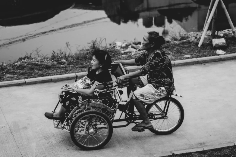 two people that are riding on the same bike