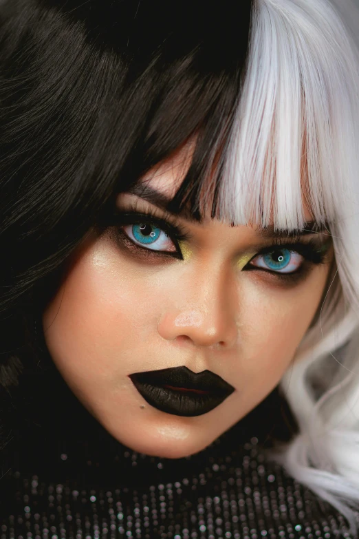 there is a model with black lipstick on her face