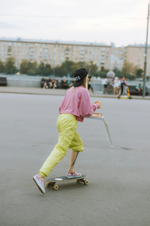 the skateboarder balances on his board, balancing himself