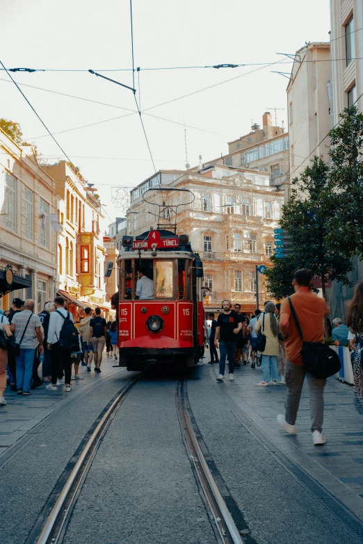 a cable car is riding down the tracks of the city