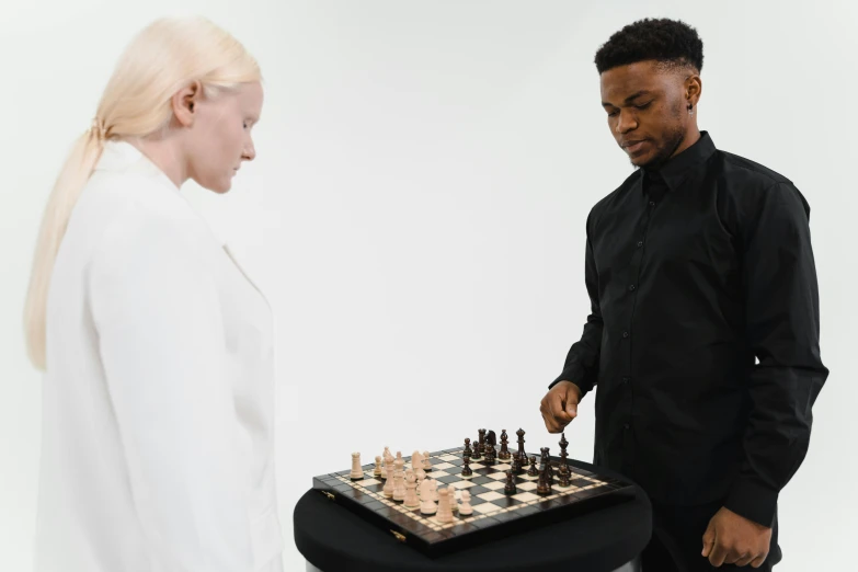 the chess player and the blonde woman play their game together