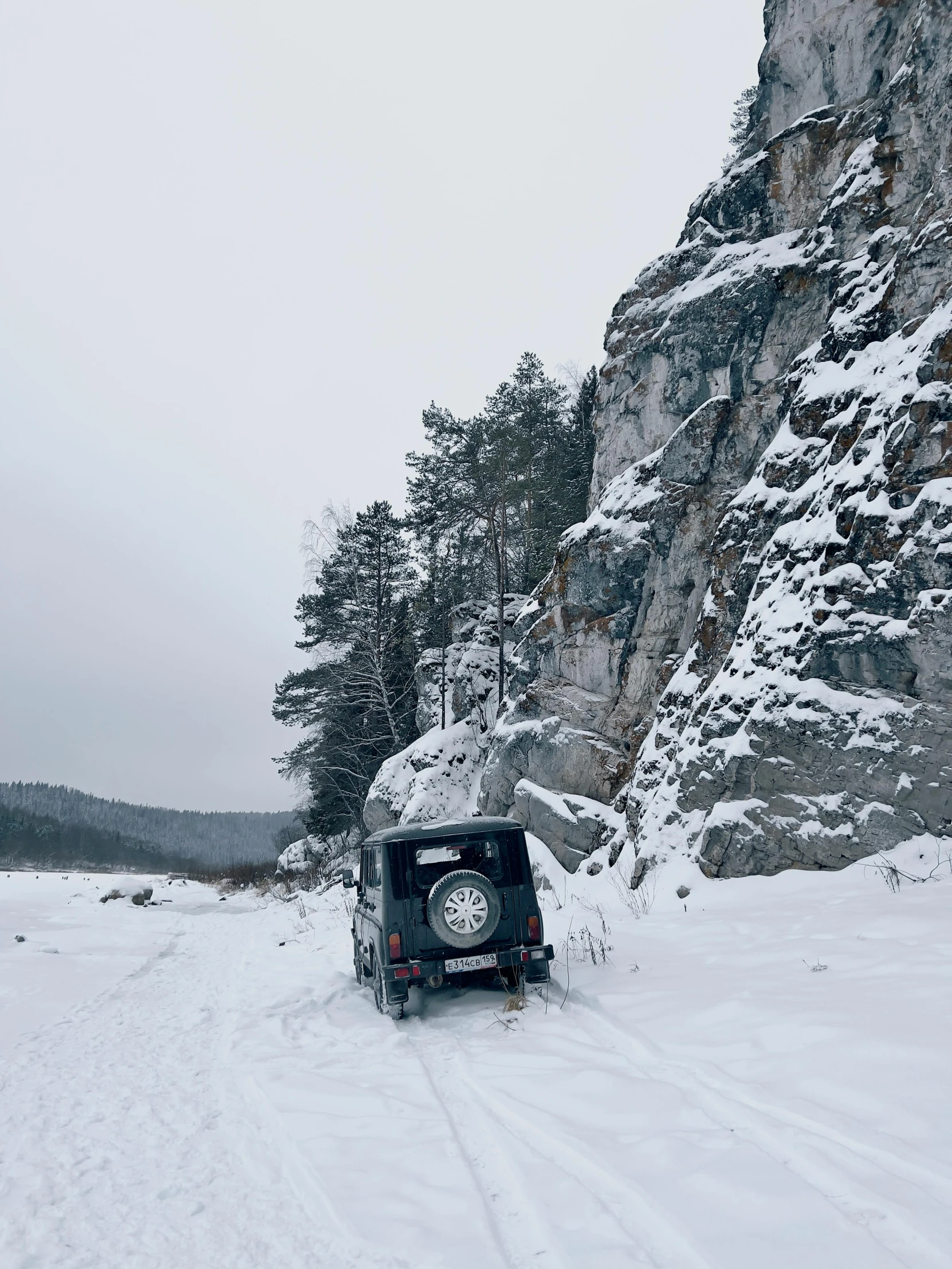 the vehicle is stuck in deep snow on the road