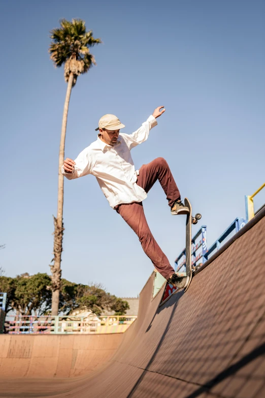 a person on a skateboard on a skate board ramp