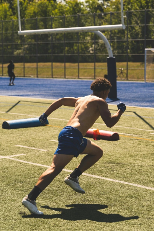 a man with  in the field with a frisbee