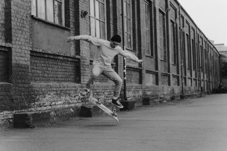 a young man jumping in the air with his skateboard