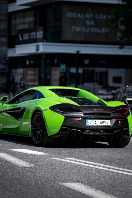 a car with two seats in green in the city