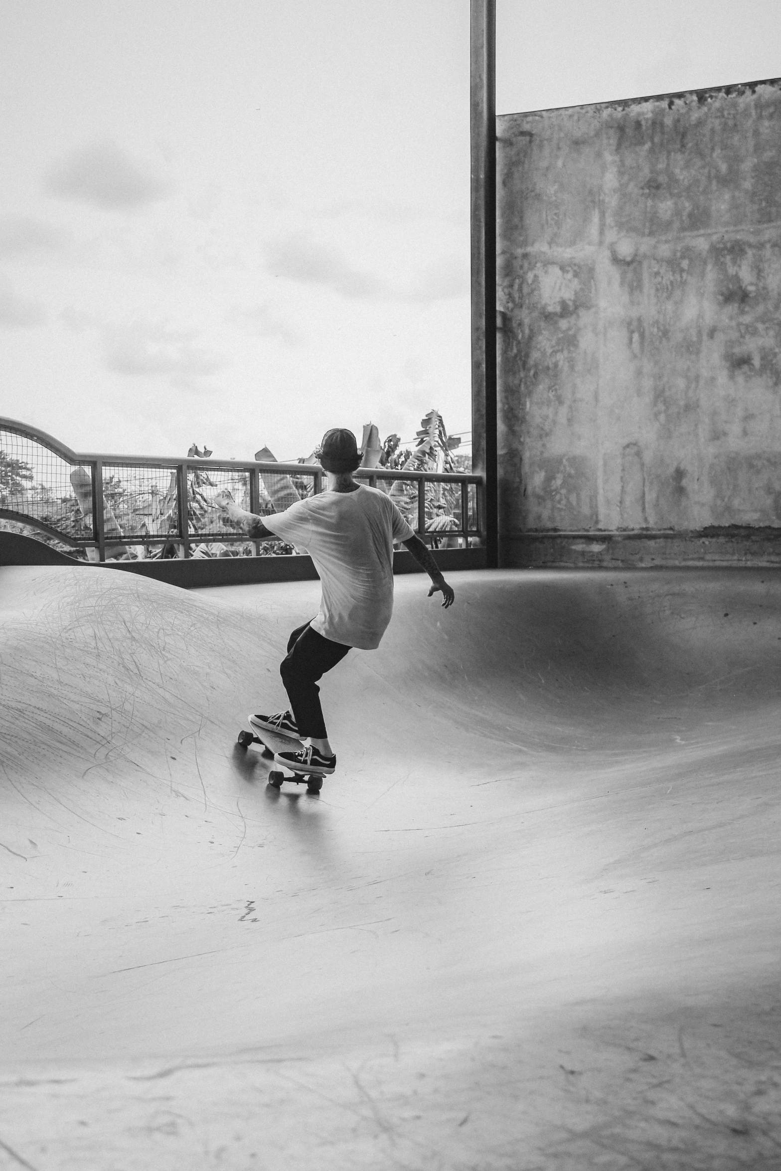 skateboarder at the top of a skate ramp