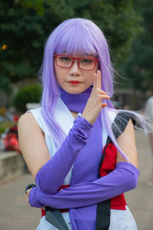a girl is standing in the street dressed in purple and white