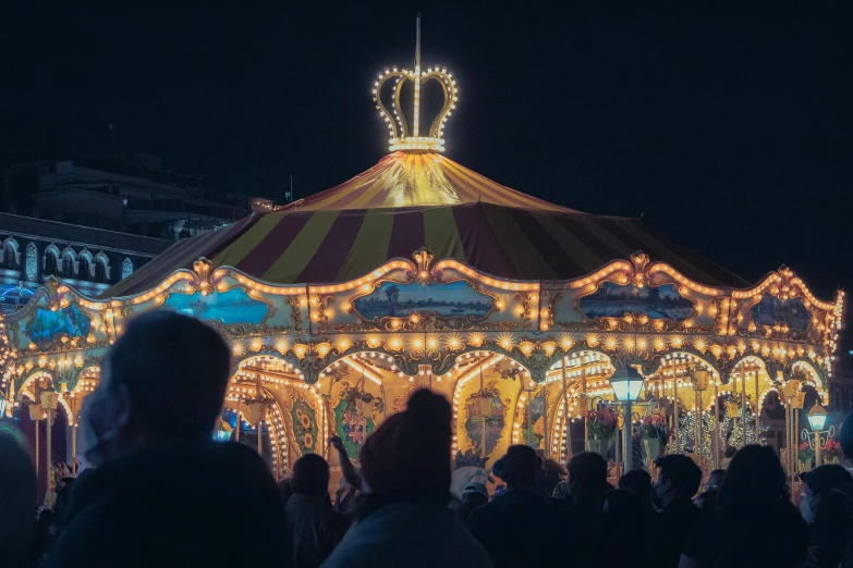 a carousel that is lit up in the night