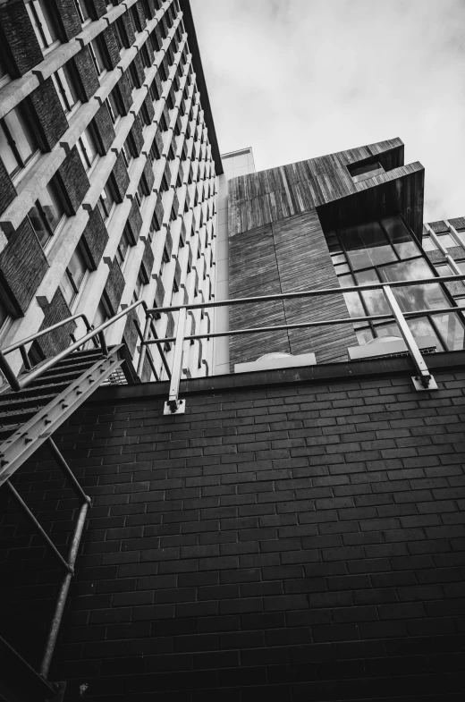 black and white image of the top part of a building with window frames