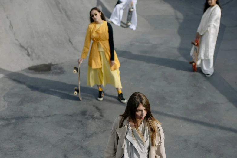 two girls skateboarding at a skateboard park