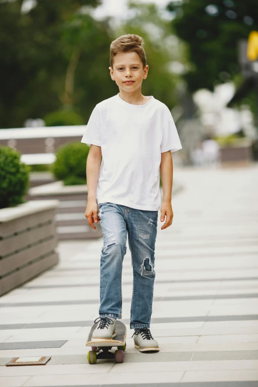 a  riding a skateboard on a sidewalk