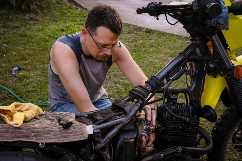 a person on a motorcycle looking at soing
