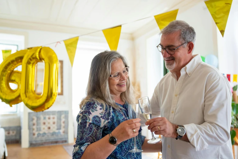 a man and a woman toasting with wine