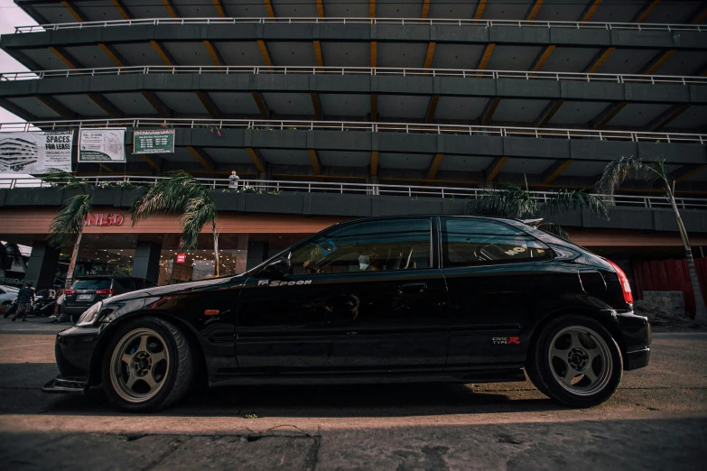 a black sports car parked on the side of the road