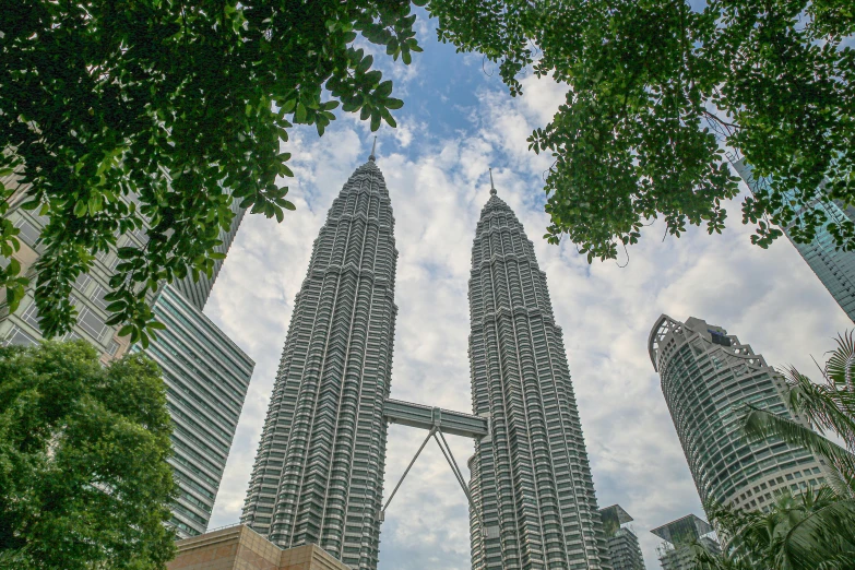 two tall skyscrs rising high in the air