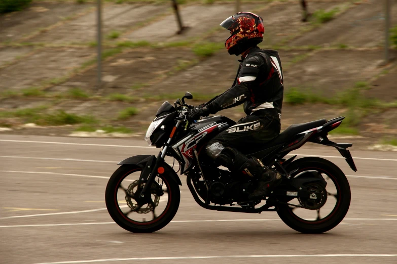 the motorcycle rider is wearing protective gear