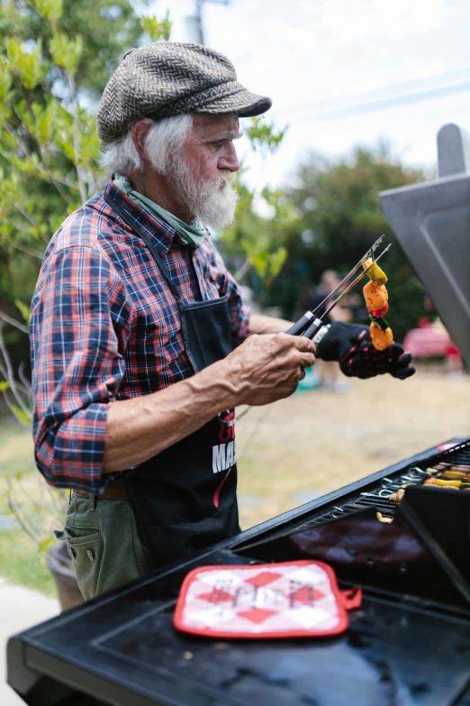 a man in an apron using a multi - tool