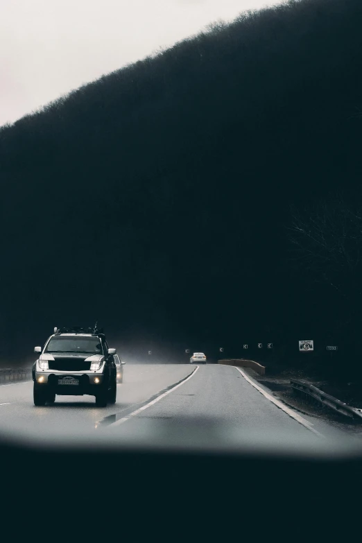 this is a vehicle going down a mountain road