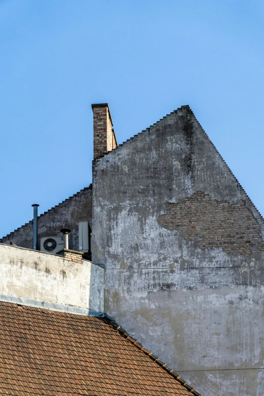 a house with brick roofs against the blue sky