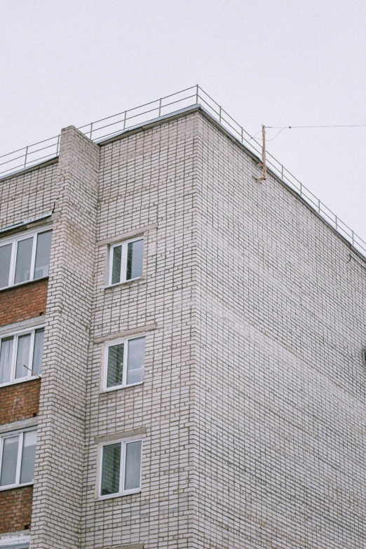 a tall building that has many windows on top of it