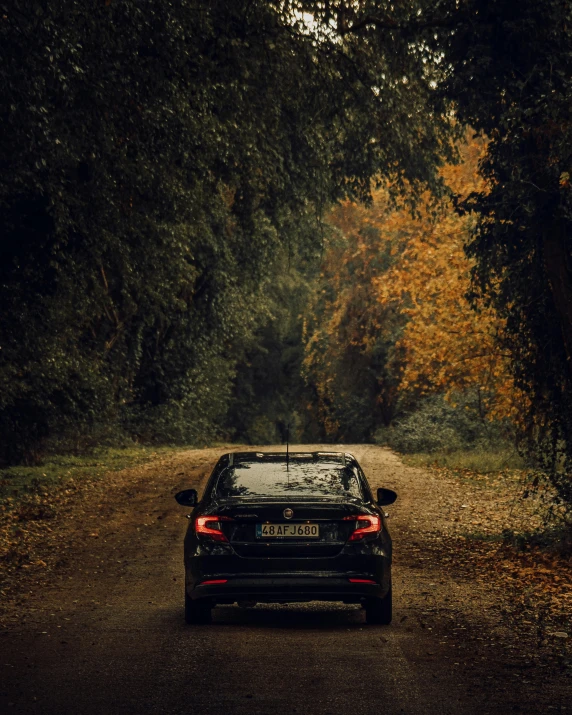 the car is parked in the middle of the road