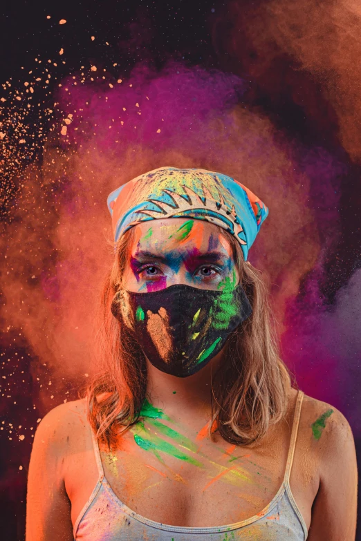 a woman wearing paint covered face posing for the camera