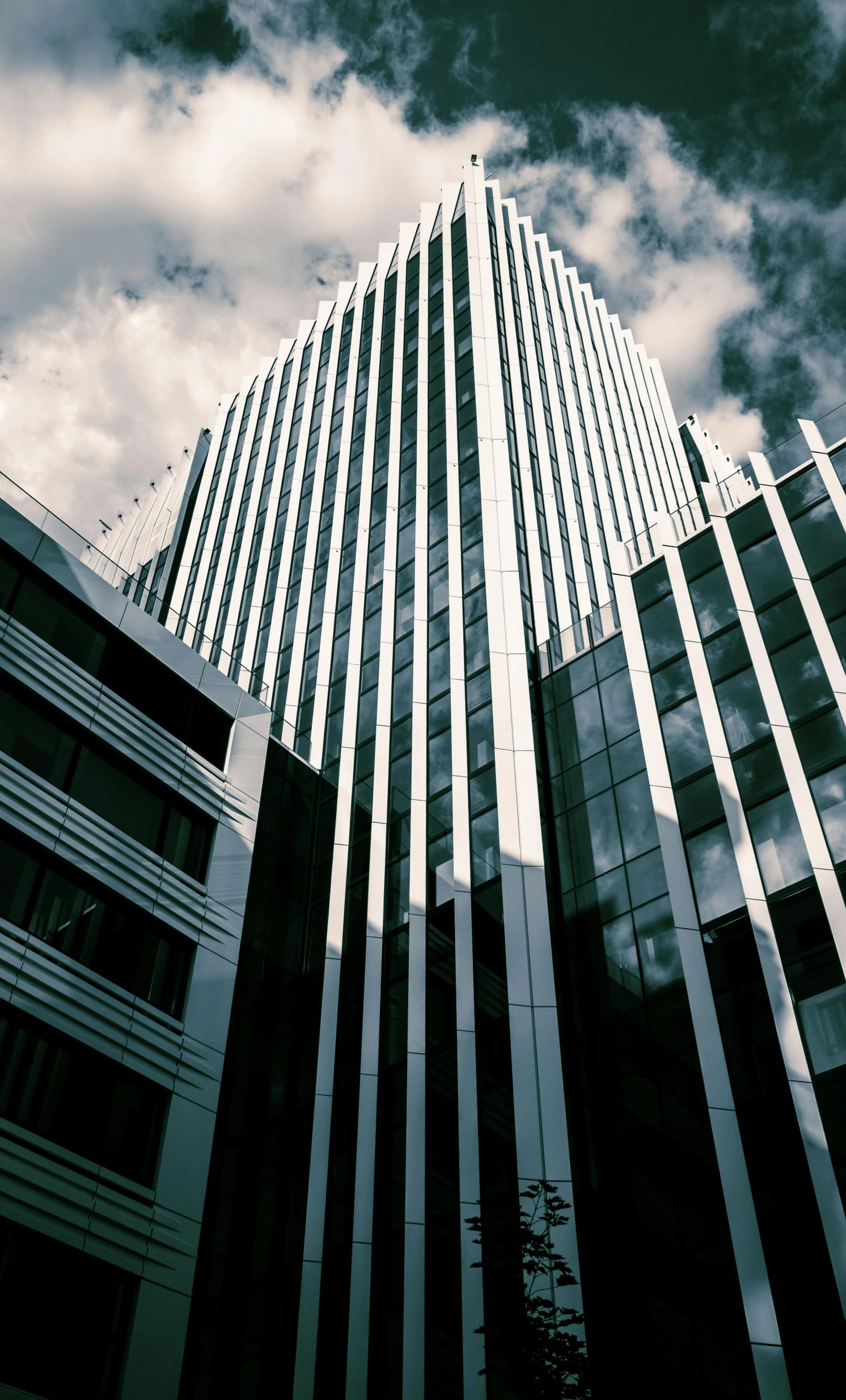 two buildings against the cloudy sky