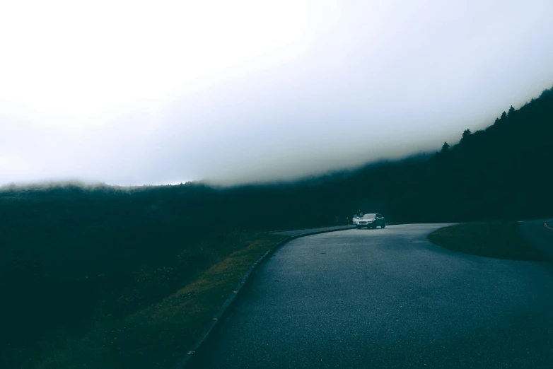 a road next to some very big mountains