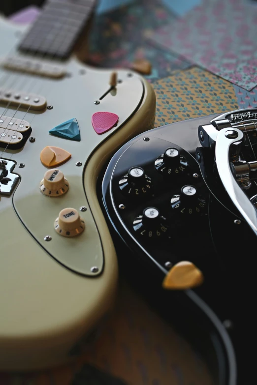 a closeup view of two electric guitars