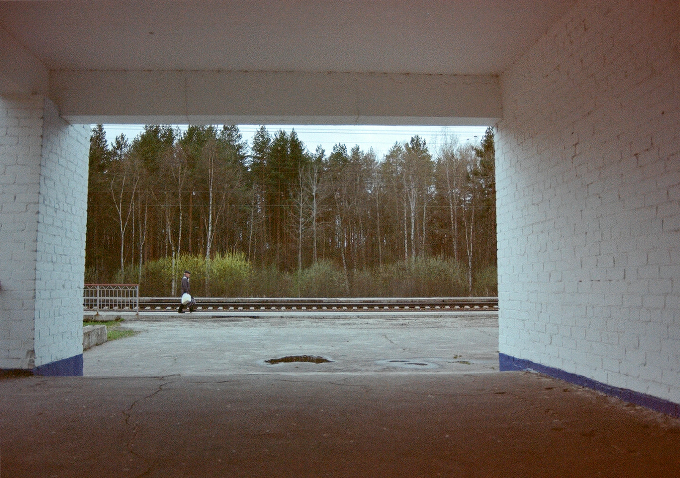 a person on a skateboard traveling down a walkway