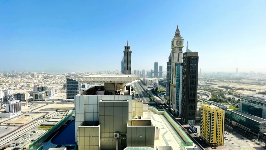 a building and skyscrs in the city, with a beautiful sky