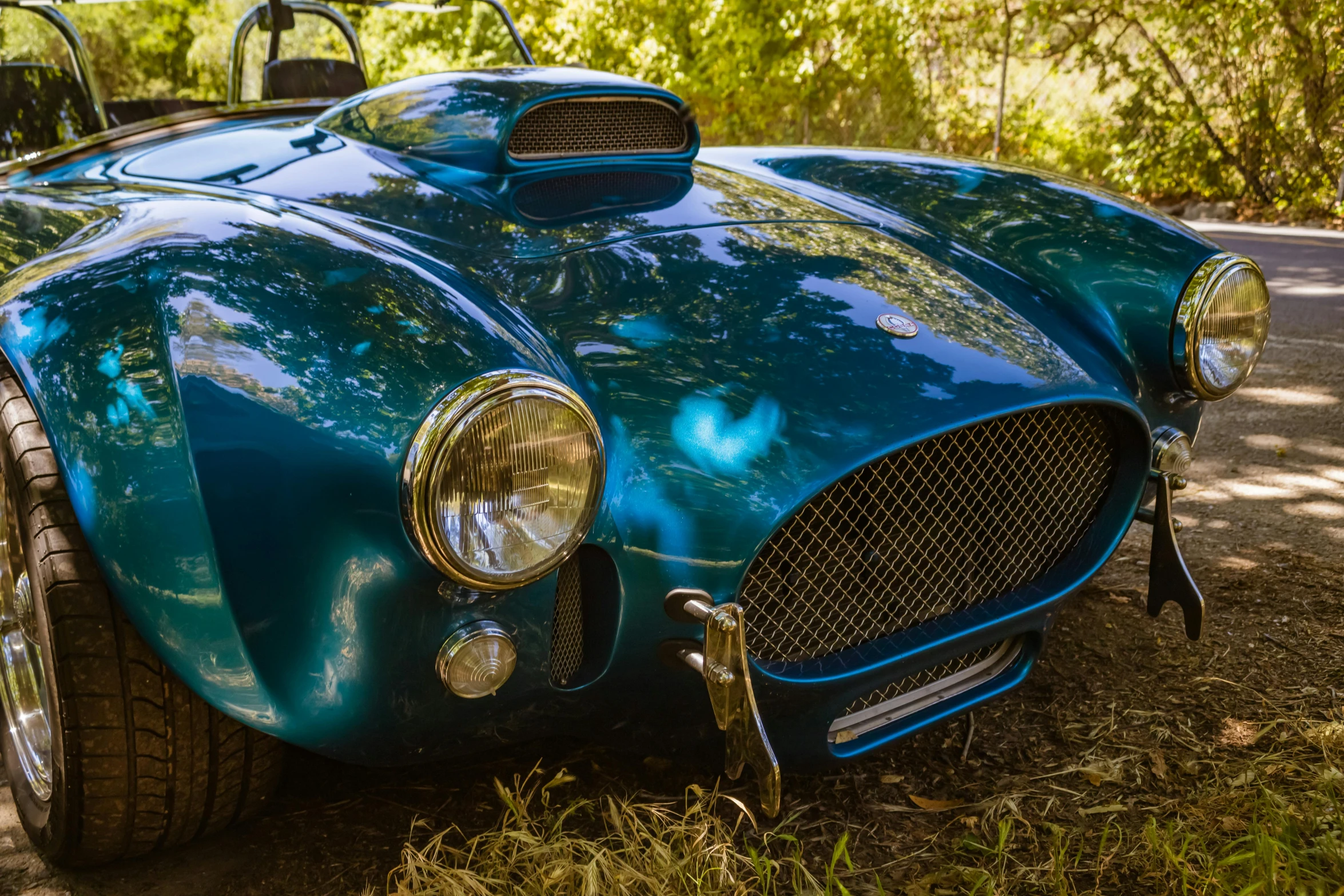 the front of an antique race car, with chrome