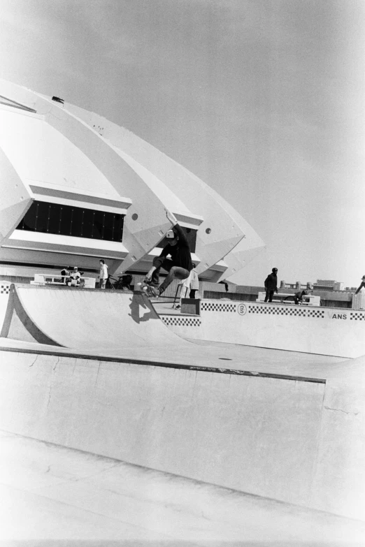 there is a skateboarder on a ramp outside