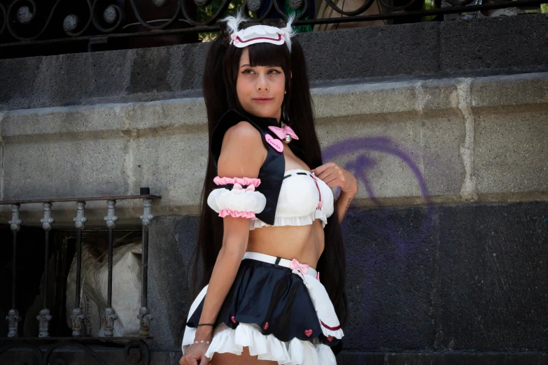 a woman in a pink and white costume holding a purse