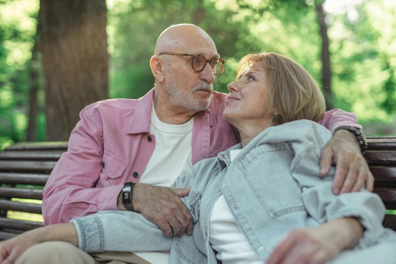 an older couple enjoying a moment on a park bench