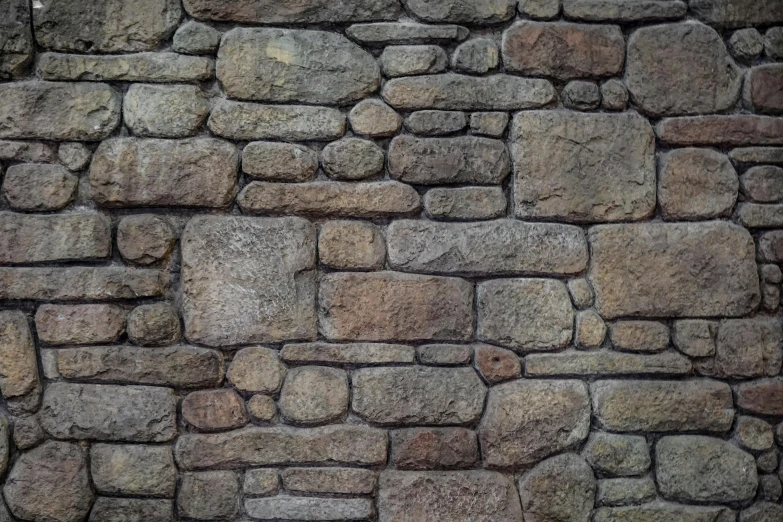 the texture of a stone wall made of small stones