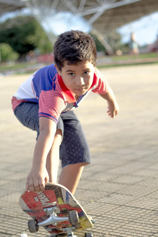 a  is on his skateboard and ready to begin riding