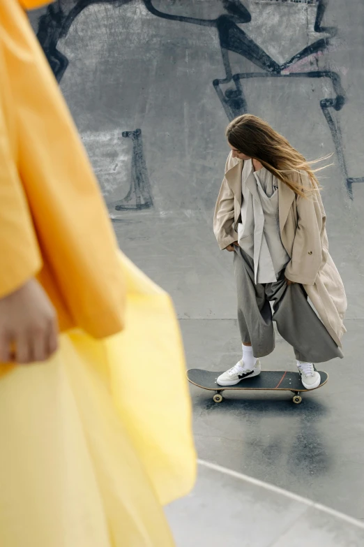 a girl riding on top of a skateboard