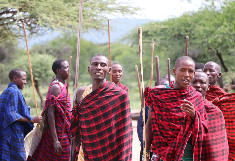 several men standing together near each other in checkered red clothing