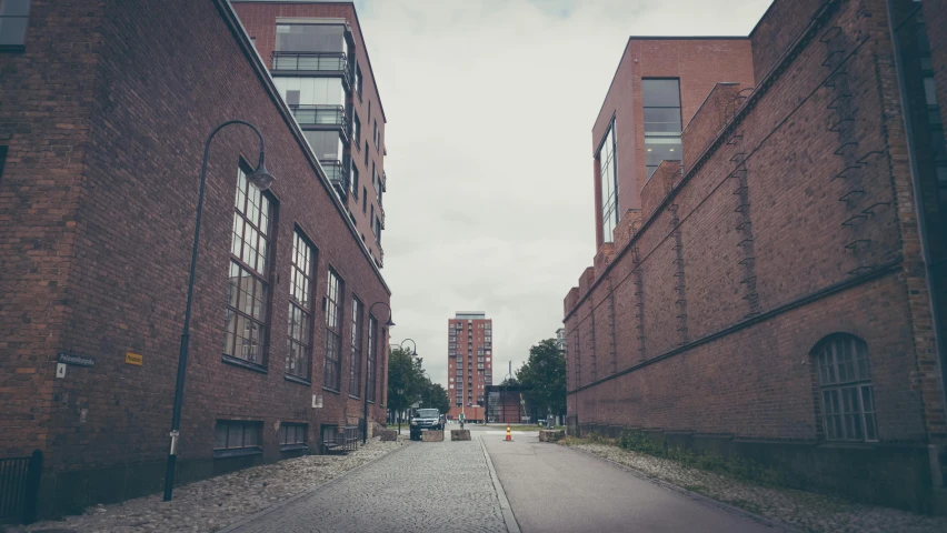 an empty city street between two buildings