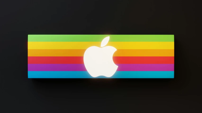 a colorful apple sticker over an apple logo