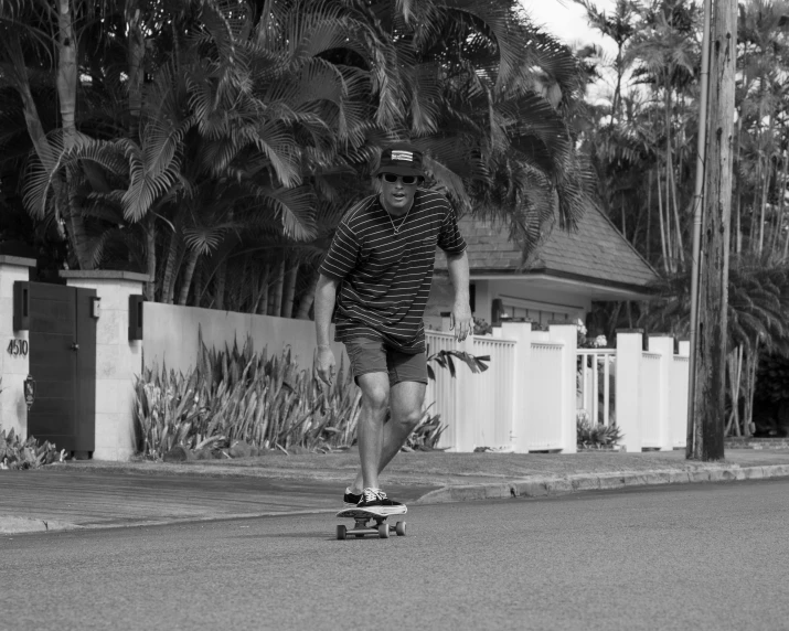 this is an old pograph of a man on a skateboard