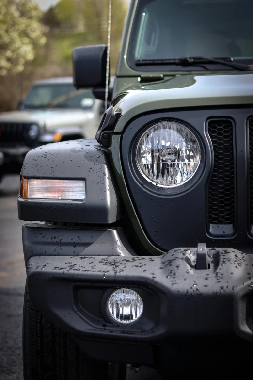 a jeep is being driven down a road