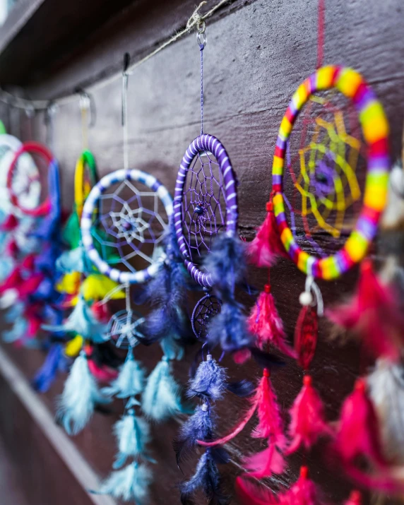 colorful handmade objects hung from the wall