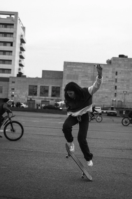 a boy jumps his skateboard and performs a trick