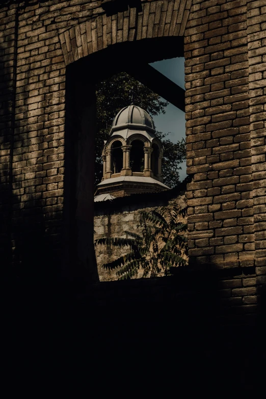 a clock tower in the middle of a brick building