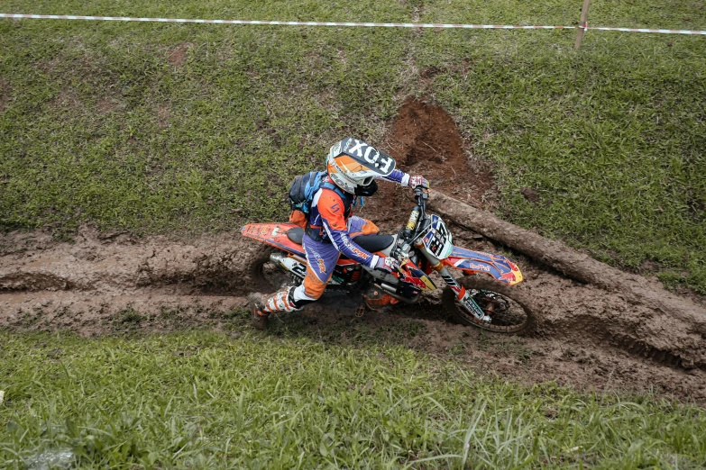 a person riding on the back of a dirt bike